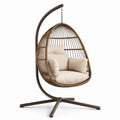 Sillón colgante de ratán con estructura de acero y cojines beige